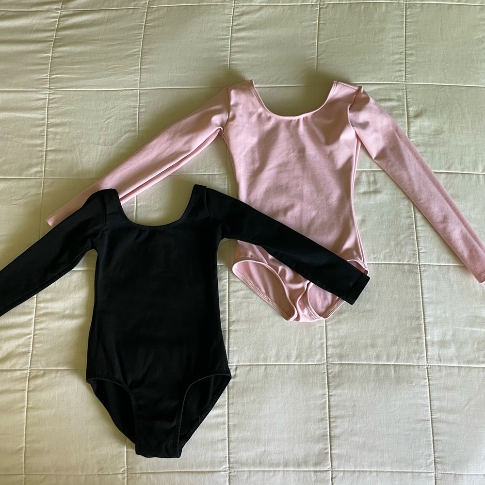 Girls Dance Leotards. 4T. Includes one pink and one black long-sleeved leotard.
